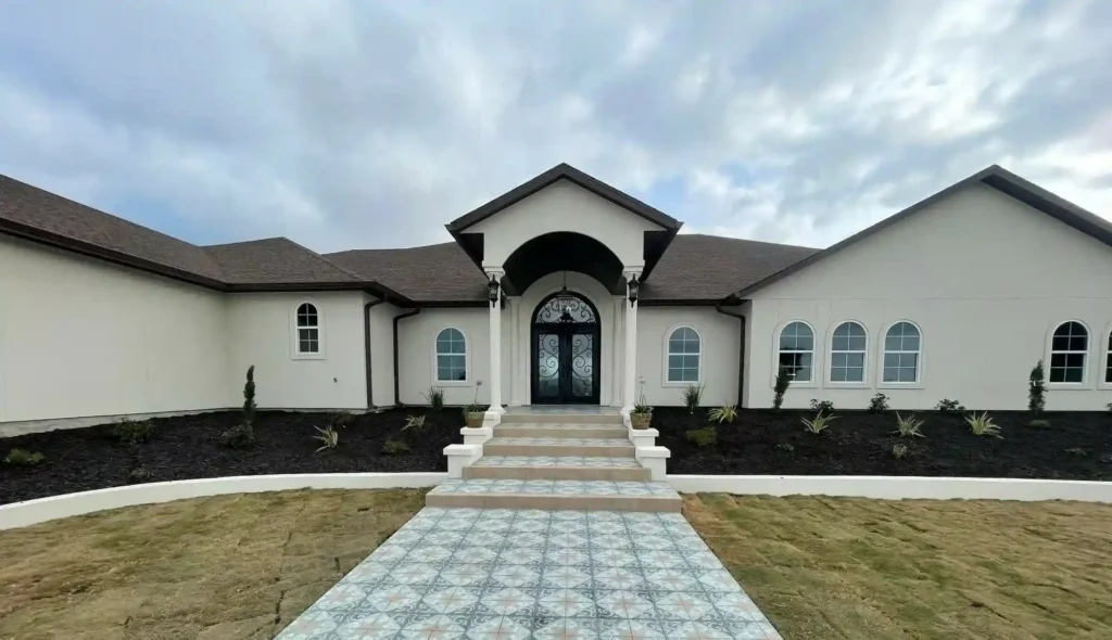Front exterior of modern home with archway.