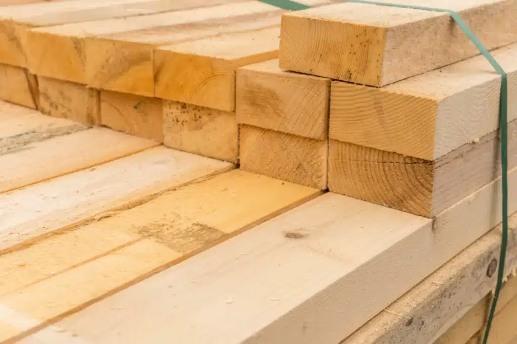 Stack of dimensional lumber construction materials bundled together